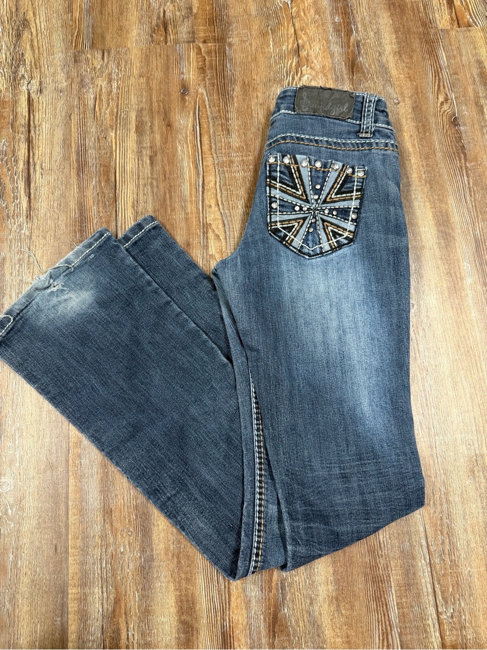 Vintage Y2K low rise bootcut jeans with rhinestone back pocket design in size 3